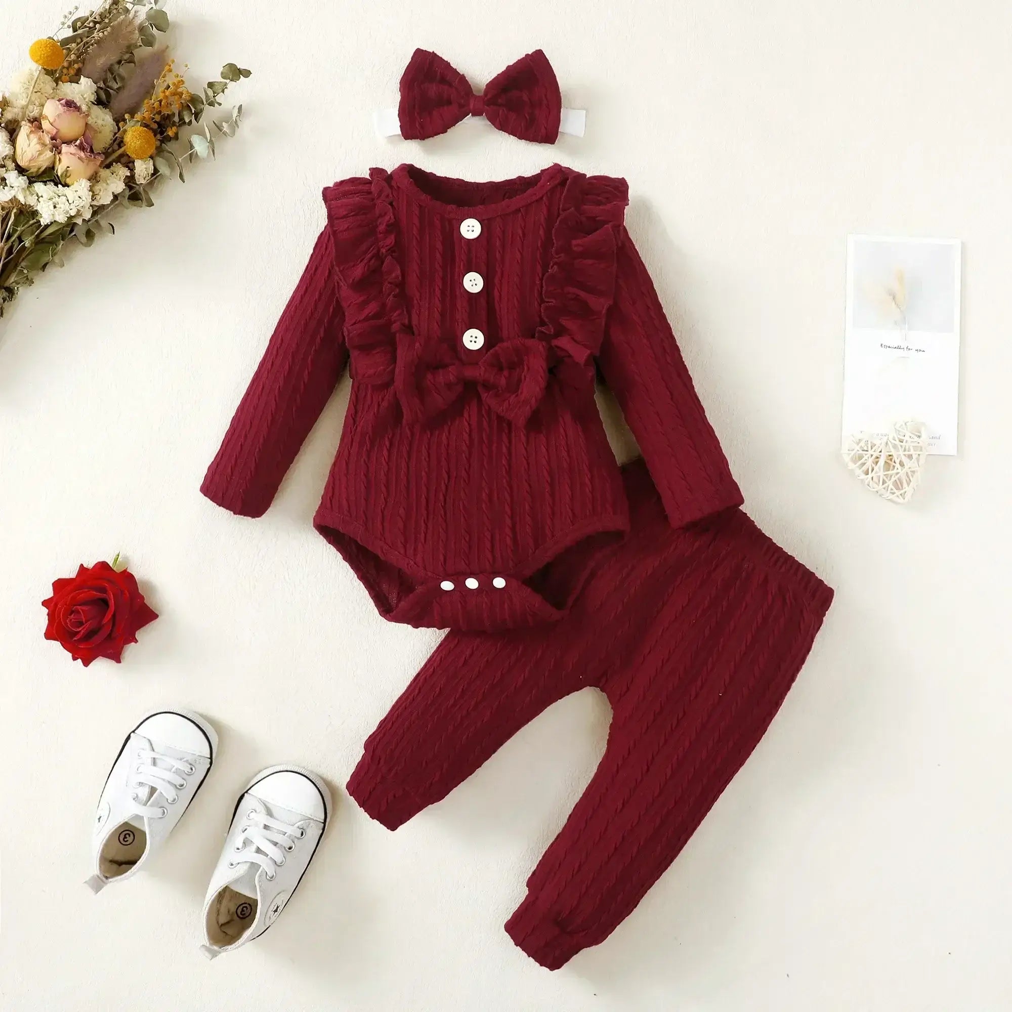 This autumn, dress your newborn girl in style with our long sleeve romper and pants set.