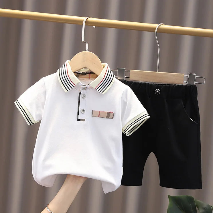 Upgrade your little one's wardrobe with our sophisticated Summer Toddler Boys Polo Shirt & Shorts 2PC Set.