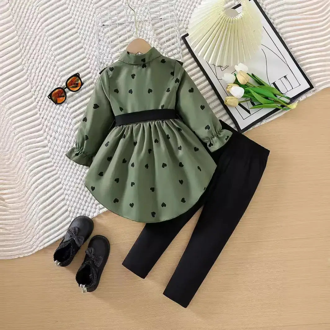 This adorable outfit features a long shirt dress and pants that will make your little girl stand out.