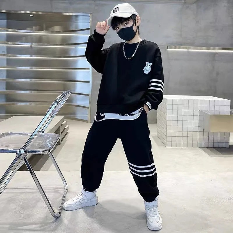 Keep your little one cozy and cute this autumn with this playful Boys Autumn Teddy Bear Striped Sweatshirt and Pants set. 