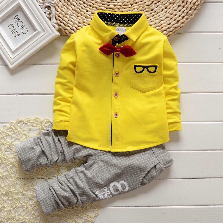 Dress your toddler to impress with this stylish long-sleeve, button-up shirt with bow tie and matched pants!