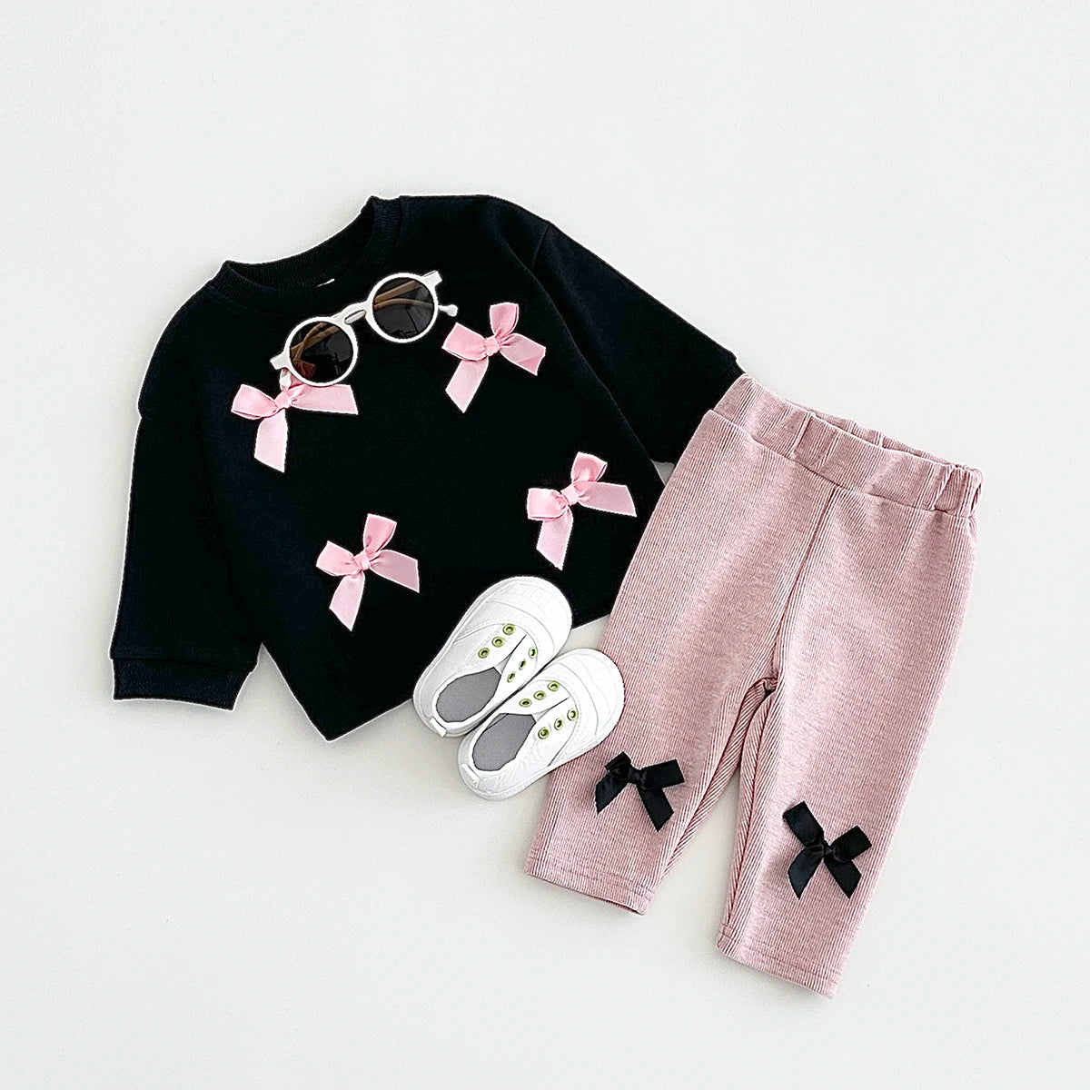 Get your little fashionista ready for spring with this stylish Bow Top and pants set.