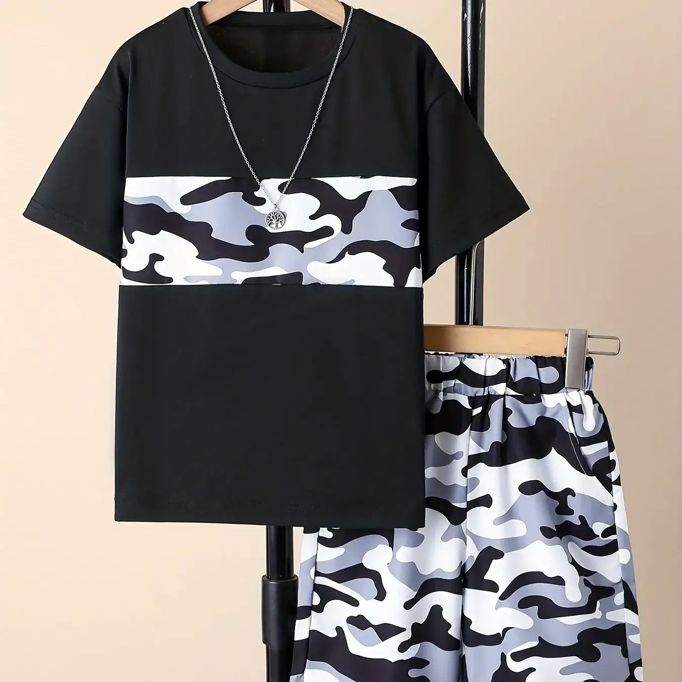 This summer, dress your little boy in the stylish and comfortable Camouflage Round Neck T-shirt and Shorts set!