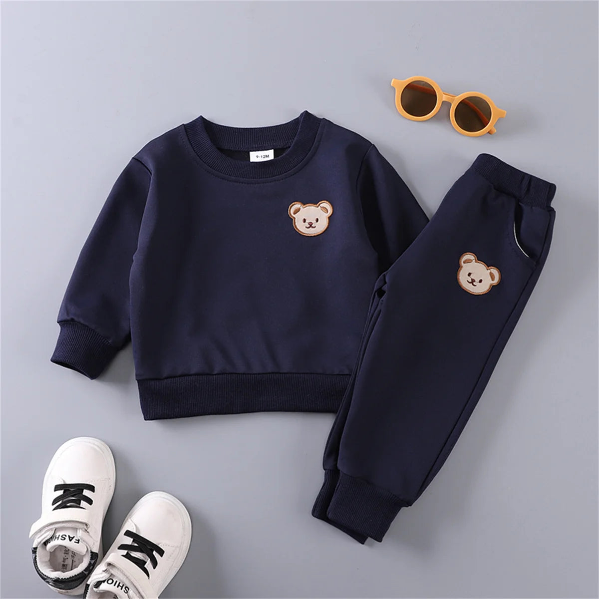 Let your little one's new favorite cozy combo be the Infant Winter Teddy Bear Face Sweatshirt and Pants! This adorable two-piece set features a cuddly teddy bear face sweatshirt paired with matching pants.