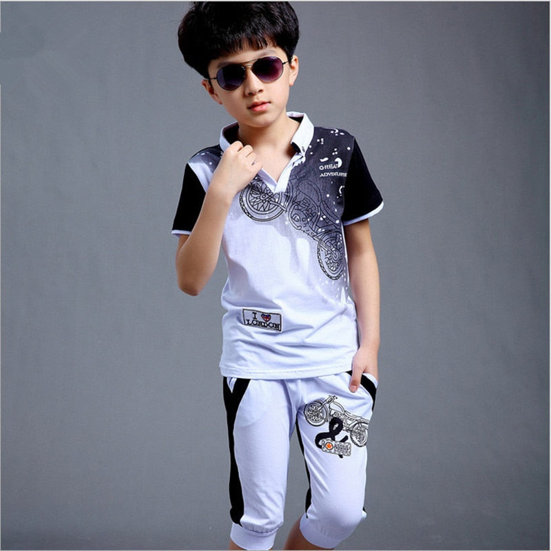 Your boy will look stylish and chic in this boys Action Print Short Sleeve Shirt and Shorts set.